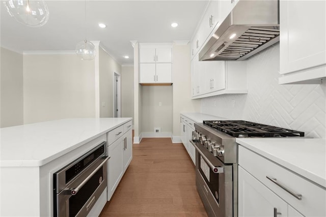 1417 Coretta Scott Bnd, Atlanta, GA 30318 - kitchen with stainless steel appliances, exhaust hood, ornamental molding, tasteful backsplash, and white cabinetry