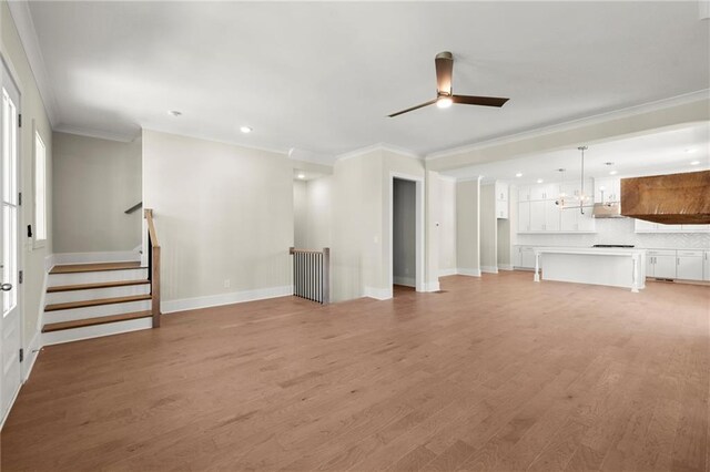 1417 Coretta Scott Bnd, Atlanta, GA 30318 - unfurnished living room featuring crown molding, light wood finished floors, a ceiling fan, baseboards, and recessed lighting