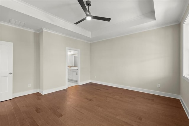 1417 Coretta Scott Bnd, Atlanta, GA 30318 - unfurnished room with a tray ceiling, ceiling fan, dark wood finished floors, crown molding, and baseboards