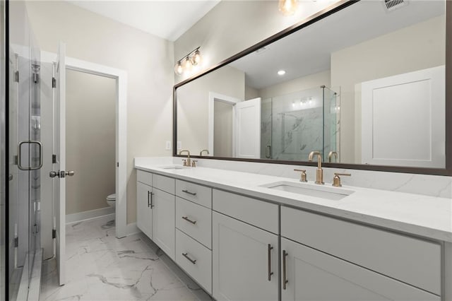 1417 Coretta Scott Bnd, Atlanta, GA 30318 - full bath with double vanity, marble look tile flooring, toilet, a marble finish shower, and baseboards