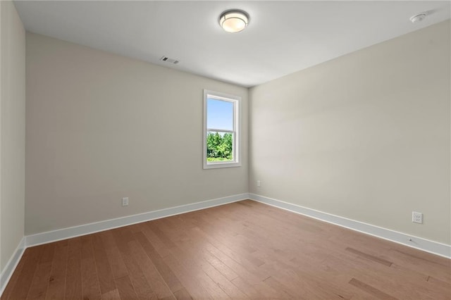 1417 Coretta Scott Bnd, Atlanta, GA 30318 - empty room with hardwood / wood-style floors, baseboards, and a smoke detector