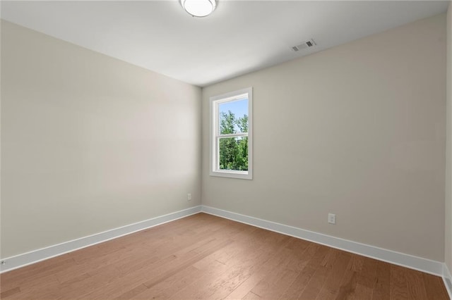 1417 Coretta Scott Bnd, Atlanta, GA 30318 - spare room with baseboards and light wood-style floors