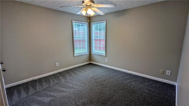 4373 Abram Dr, Conley, GA 30288 - spare room featuring dark colored carpet, ceiling fan, baseboards, and a textured ceiling
