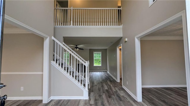 4373 Abram Dr, Conley, GA 30288 - foyer with a towering ceiling, stairway, wood finished floors, a ceiling fan, and baseboards