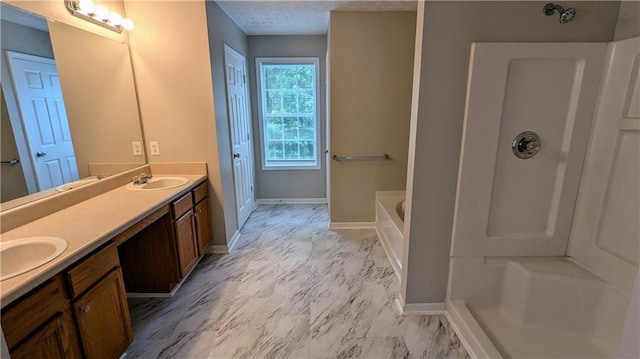 4373 Abram Dr, Conley, GA 30288 - bathroom featuring double vanity, a garden tub, a shower, and baseboards