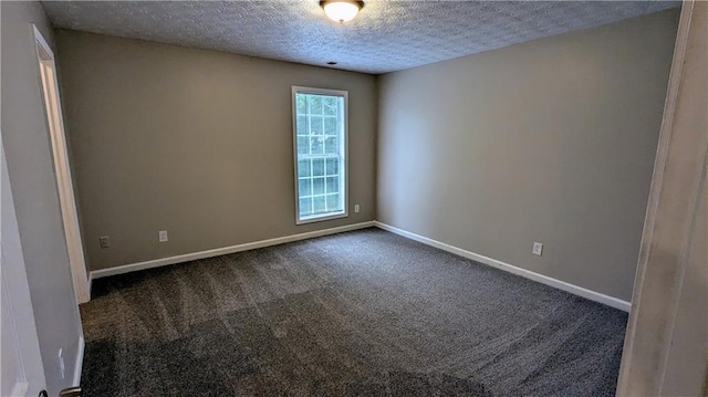 4373 Abram Dr, Conley, GA 30288 - unfurnished room featuring dark colored carpet, a textured ceiling, and baseboards