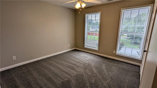 4373 Abram Dr, Conley, GA 30288 - spare room with ceiling fan, baseboards, and dark carpet