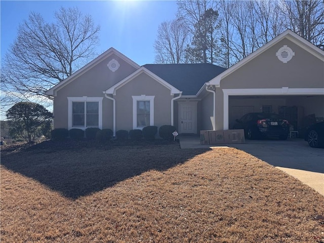 ranch-style house featuring a garage