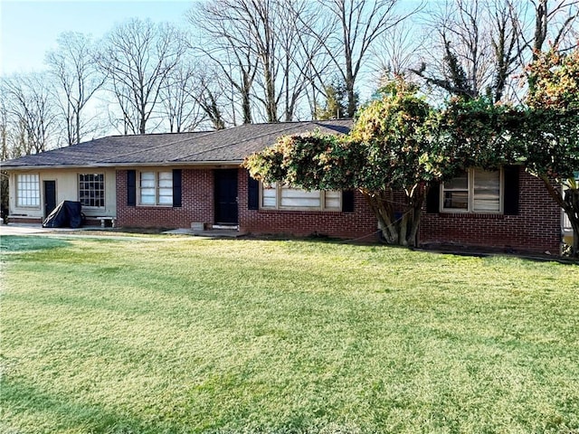 ranch-style house with a front lawn