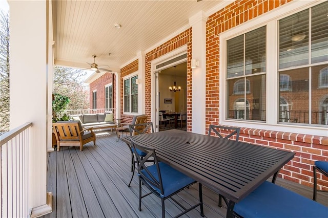 wooden deck with ceiling fan, an outdoor hangout area, covered porch, and outdoor dining area