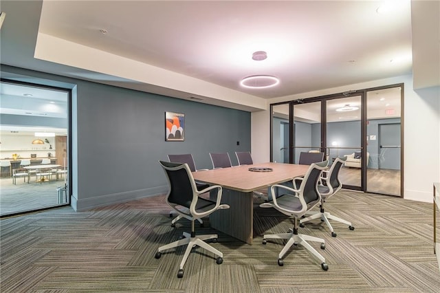 carpeted office with baseboards