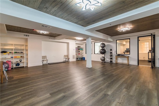 exercise area featuring wood finished floors, wood ceiling, baseboards, and visible vents