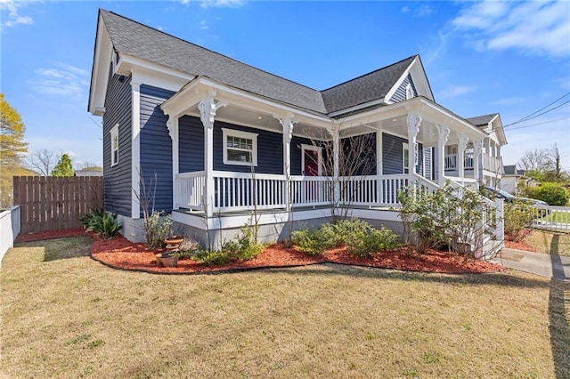 459 James P Brawley Dr NW, Atlanta, GA 30318 - view of front of home with fence, roof with shingles, a porch, and a front yard