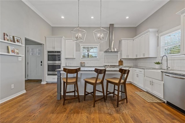 459 James P Brawley Dr NW, Atlanta, GA 30318 - kitchen with a sink, white cabinetry, wall chimney exhaust hood, and appliances with stainless steel finishes