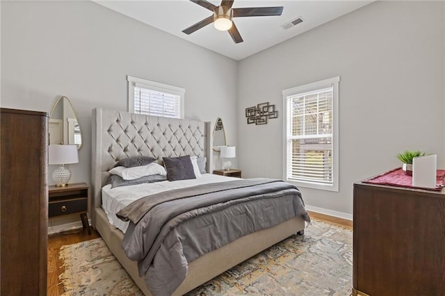 459 James P Brawley Dr NW, Atlanta, GA 30318 - bedroom with visible vents, baseboards, ceiling fan, and wood finished floors