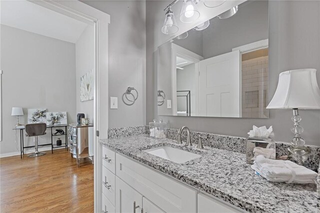 459 James P Brawley Dr NW, Atlanta, GA 30318 - bathroom featuring baseboards, wood finished floors, and vanity