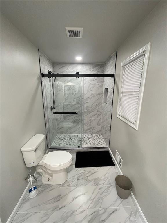 2166 Lake Ridge Ter, Lawrenceville, GA 30043 - full bathroom featuring baseboards, toilet, marble finish floors, and a shower stall