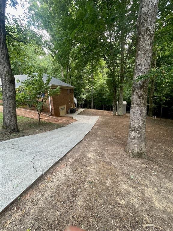 2166 Lake Ridge Ter, Lawrenceville, GA 30043 - view of yard featuring concrete driveway