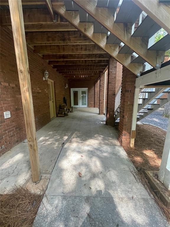 2166 Lake Ridge Ter, Lawrenceville, GA 30043 - view of patio / terrace with stairs and french doors