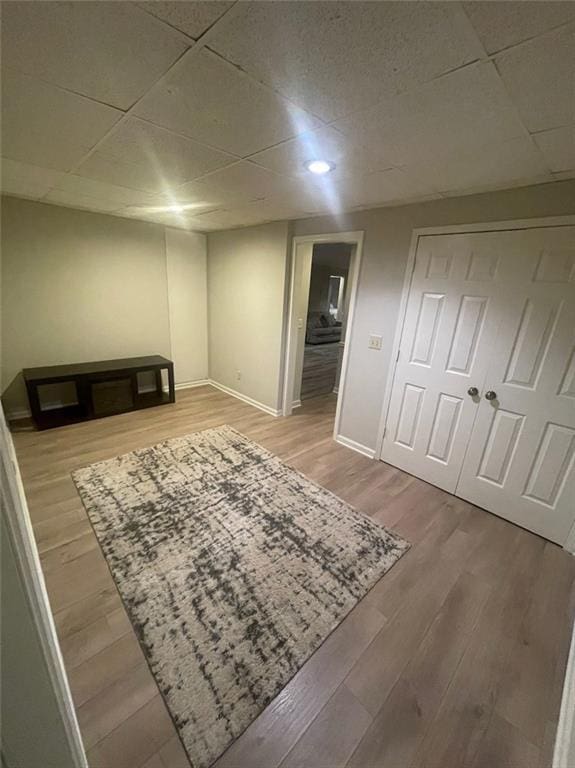 2166 Lake Ridge Ter, Lawrenceville, GA 30043 - finished basement with a drop ceiling, wood finished floors, and baseboards