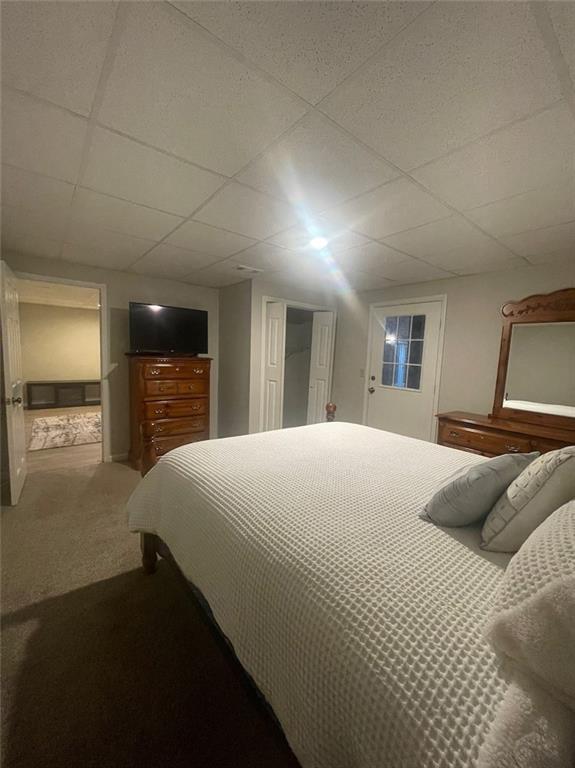 2166 Lake Ridge Ter, Lawrenceville, GA 30043 - carpeted bedroom with a paneled ceiling