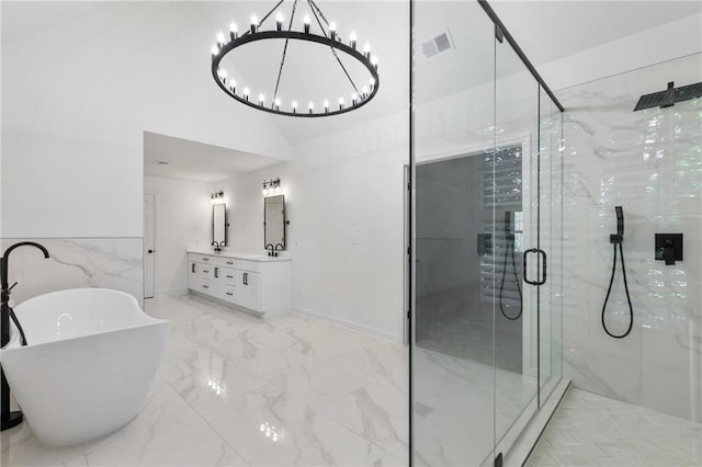 bathroom with plus walk in shower, vanity, and a notable chandelier