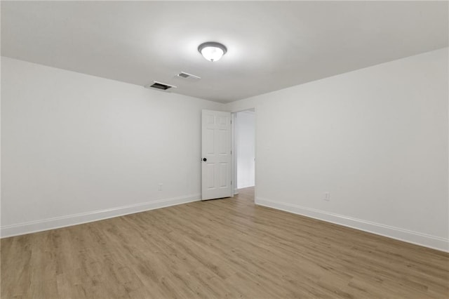 unfurnished room with light hardwood / wood-style floors