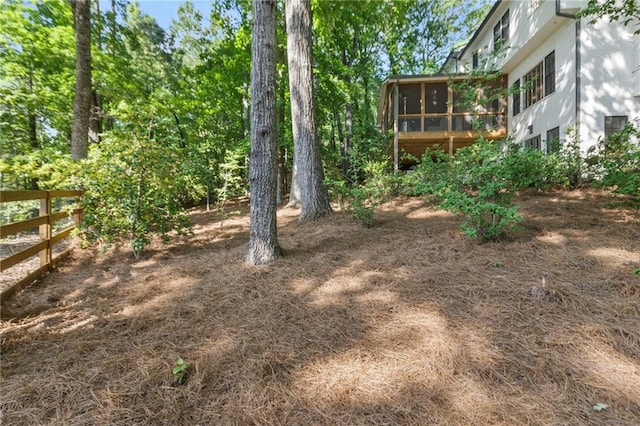 view of yard featuring a sunroom