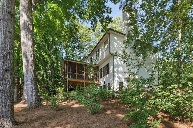 back of property featuring a sunroom