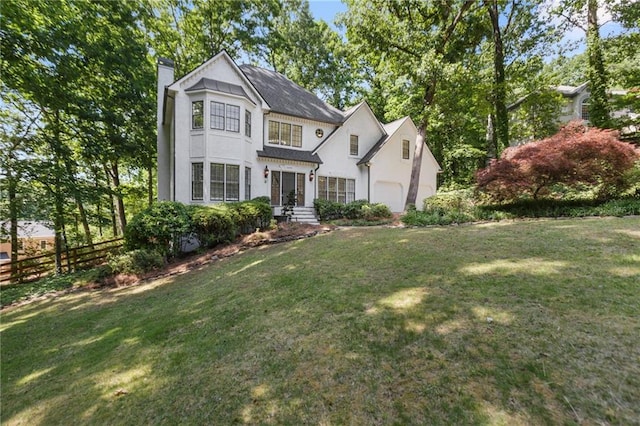 view of front facade with a front lawn and a garage