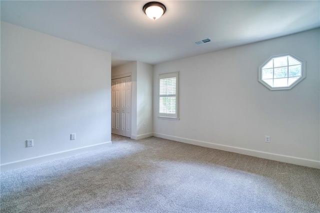 unfurnished room with carpet