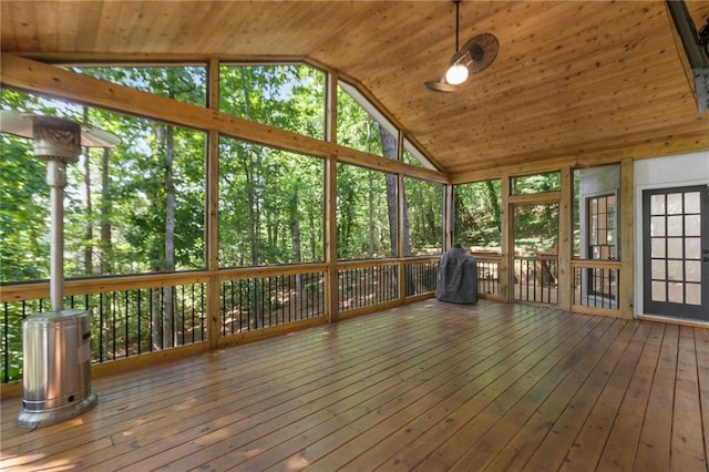 unfurnished sunroom with lofted ceiling and wood ceiling