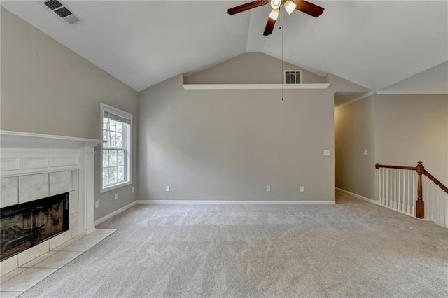 unfurnished living room featuring a fireplace, light carpet, ceiling fan, and lofted ceiling