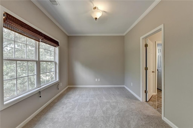 empty room with light carpet and ornamental molding