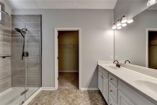 bathroom with vanity and an enclosed shower