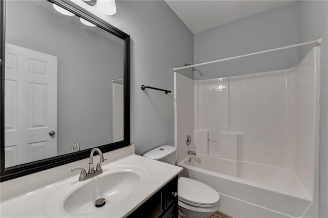 full bathroom featuring bathing tub / shower combination, vanity, and toilet