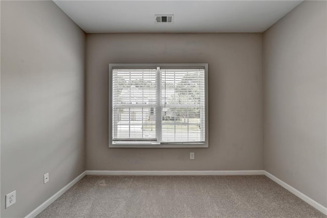 empty room featuring carpet flooring