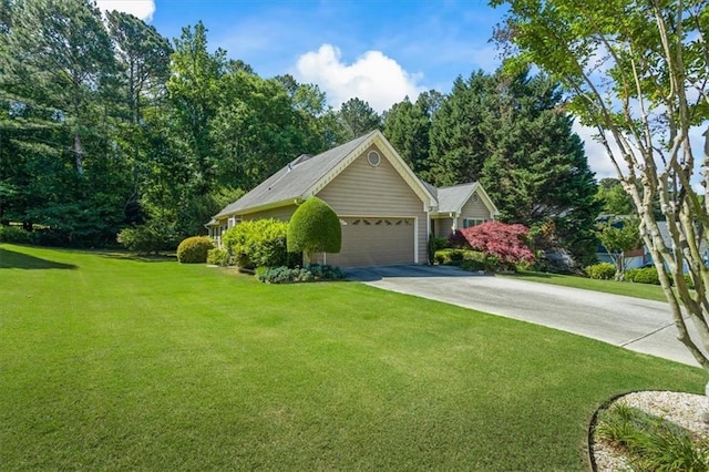 view of front facade with a front yard, driveway, and an attached garage
