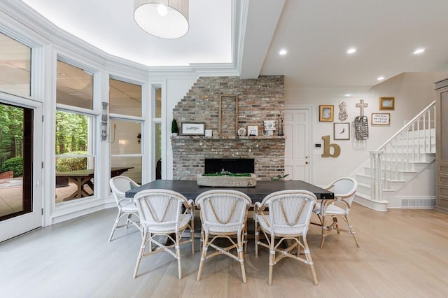dining space with stairs, recessed lighting, visible vents, and light wood finished floors
