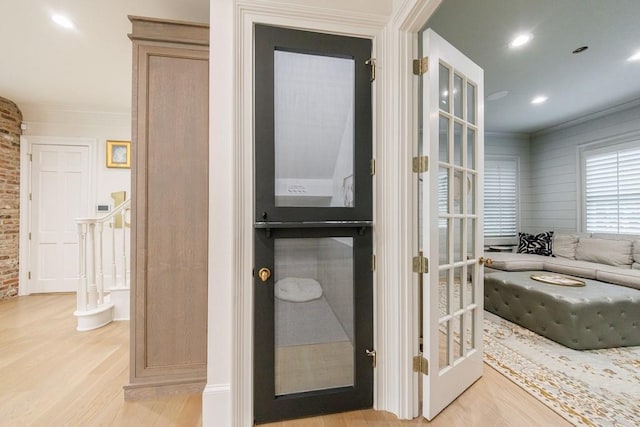 bathroom featuring recessed lighting, ornamental molding, and wood finished floors
