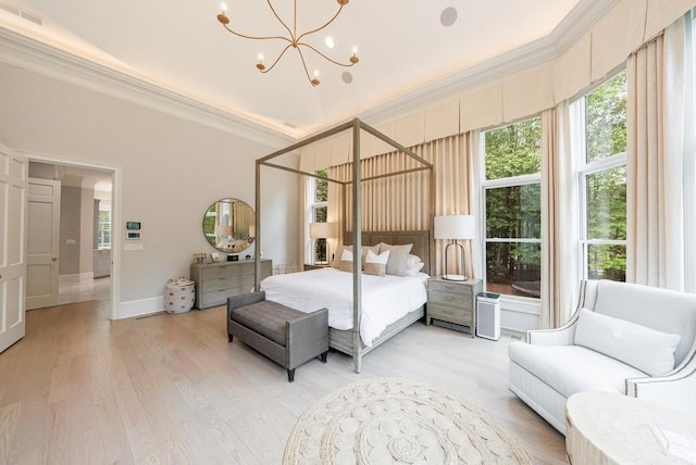 bedroom with multiple windows, ornamental molding, and visible vents