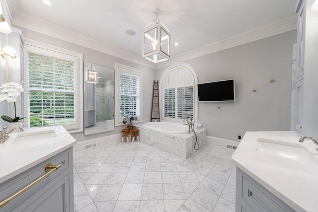 full bathroom featuring a garden tub, crown molding, two vanities, a sink, and recessed lighting