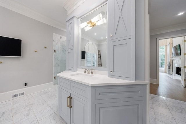 bathroom with crown molding, baseboards, marble finish floor, and a stall shower