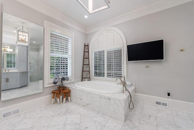 full bathroom featuring ornamental molding, a garden tub, and visible vents