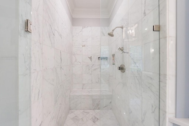 full bath with ornamental molding and tiled shower