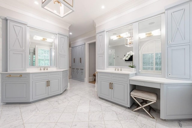 bathroom with a sink, ornamental molding, two vanities, and marble finish floor