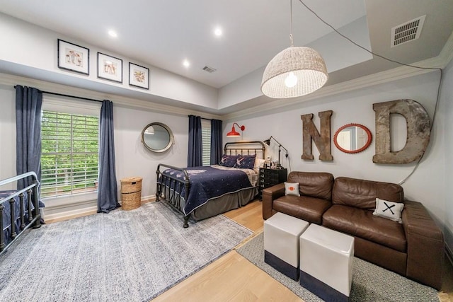 bedroom with recessed lighting, visible vents, and wood finished floors