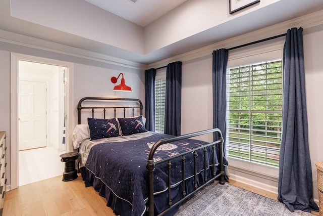 bedroom with wood finished floors