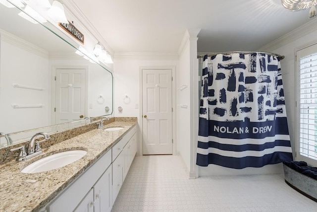 bathroom featuring double vanity, a sink, and ornamental molding
