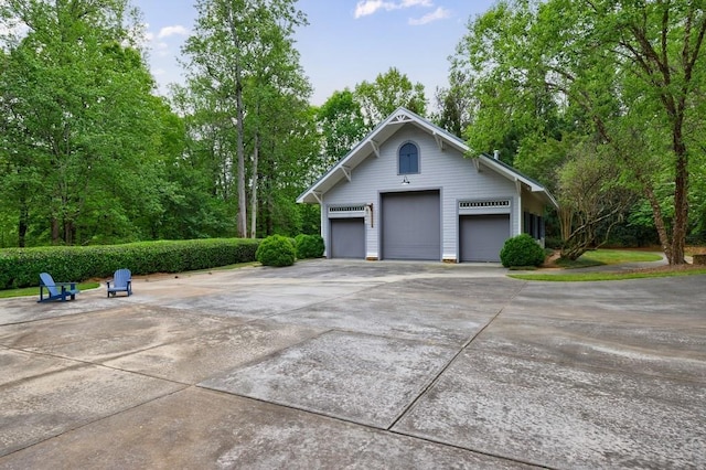 view of side of property with a garage